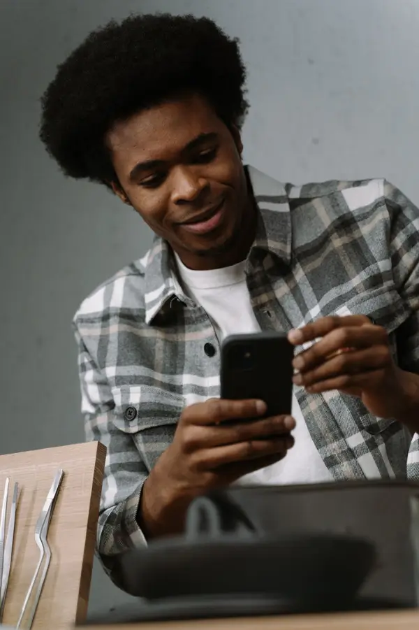 A fan checking his phone